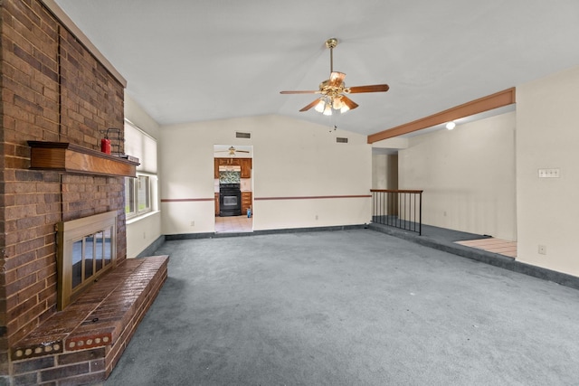 4006 Fletcher Dr, Garland, TX 75044 - unfurnished living room featuring a brick fireplace, carpet flooring, vaulted ceiling, ceiling fan, and baseboards