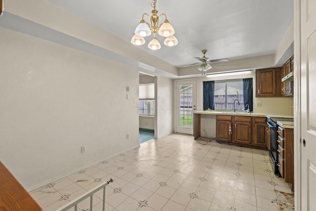 4006 Fletcher Dr, Garland, TX 75044 - kitchen featuring black electric range, light countertops, a chandelier, a sink, and a ceiling fan