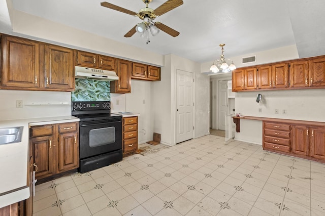 4006 Fletcher Dr, Garland, TX 75044 - kitchen with black range with electric stovetop, under cabinet range hood, ceiling fan, and brown cabinets