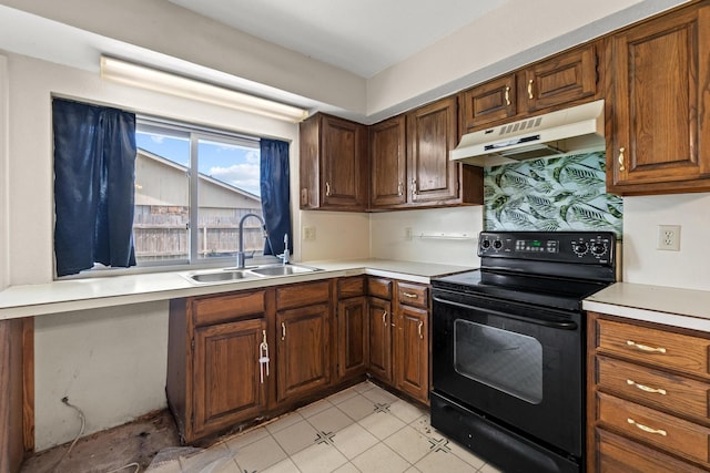 4006 Fletcher Dr, Garland, TX 75044 - kitchen featuring under cabinet range hood, black / electric stove, a sink, and light countertops
