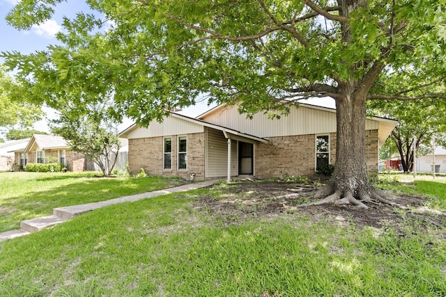 4006 Fletcher Dr, Garland, TX 75044 - view of front of home with brick siding and a front lawn
