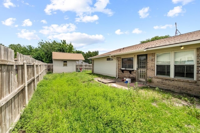 4006 Fletcher Dr, Garland, TX 75044 - fenced backyard with an outdoor structure