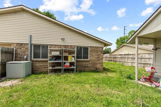 4006 Fletcher Dr, Garland, TX 75044 - rear view of property featuring central AC unit and brick siding