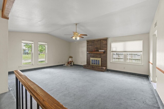 4006 Fletcher Dr, Garland, TX 75044 - unfurnished living room with carpet, a ceiling fan, a fireplace, lofted ceiling, and baseboards