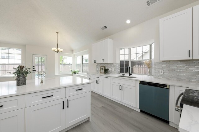 811 Chittamwood Ln, Allen, TX 75002 - kitchen with dishwashing machine, a sink, range with electric stovetop, a chandelier, and decorative backsplash
