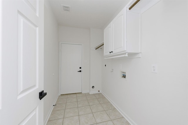 811 Chittamwood Ln, Allen, TX 75002 - laundry room featuring cabinet space, hookup for a gas dryer, light tile patterned floors, electric dryer hookup, and washer hookup