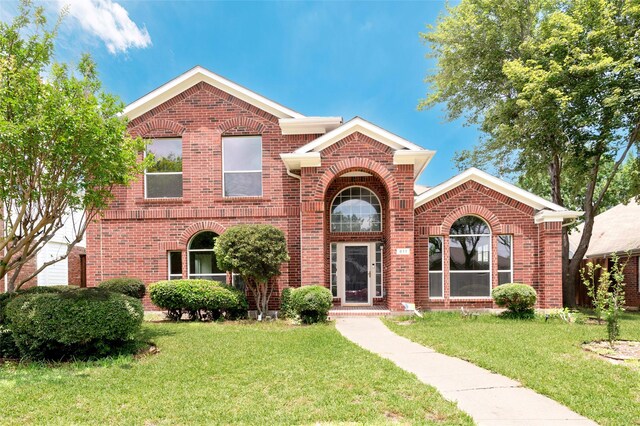 811 Chittamwood Ln, Allen, TX 75002 - traditional-style home featuring brick siding and a front yard