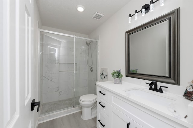 811 Chittamwood Ln, Allen, TX 75002 - bathroom featuring toilet, vanity, a shower stall, and recessed lighting