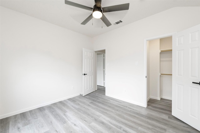 811 Chittamwood Ln, Allen, TX 75002 - unfurnished bedroom with light wood-style floors, a walk in closet, and baseboards