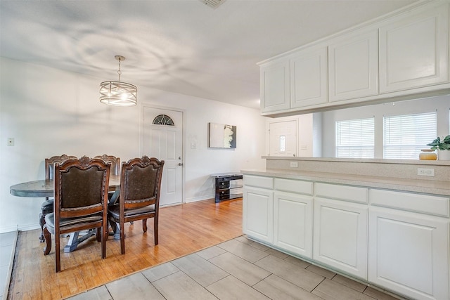 515 Euclid St, Cleburne, TX 76033 - dining space with wood tiled floors and baseboards
