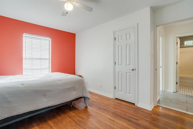 515 Euclid St, Cleburne, TX 76033 - bedroom with wood finished floors, baseboards, and ceiling fan