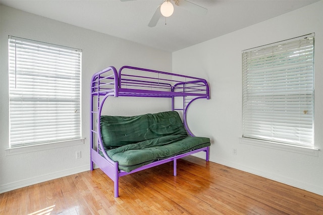 515 Euclid St, Cleburne, TX 76033 - bedroom with wood finished floors, baseboards, and ceiling fan