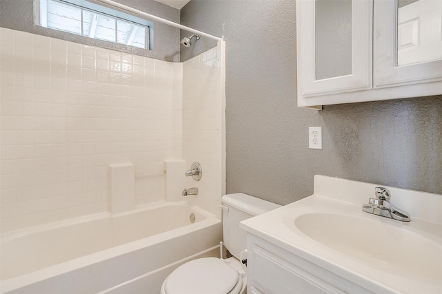 515 Euclid St, Cleburne, TX 76033 - full bathroom featuring a textured wall, toilet, washtub / shower combination, and vanity