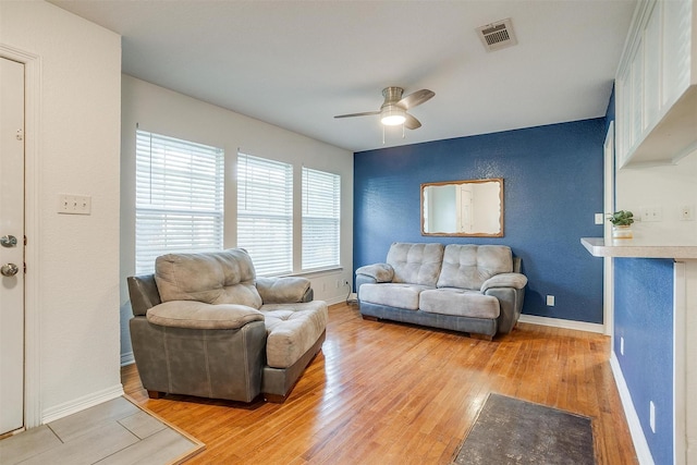 515 Euclid St, Cleburne, TX 76033 - living area with light wood-type flooring, ceiling fan, and baseboards