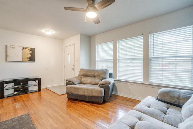 515 Euclid St, Cleburne, TX 76033 - living area featuring light wood finished floors, baseboards, and ceiling fan