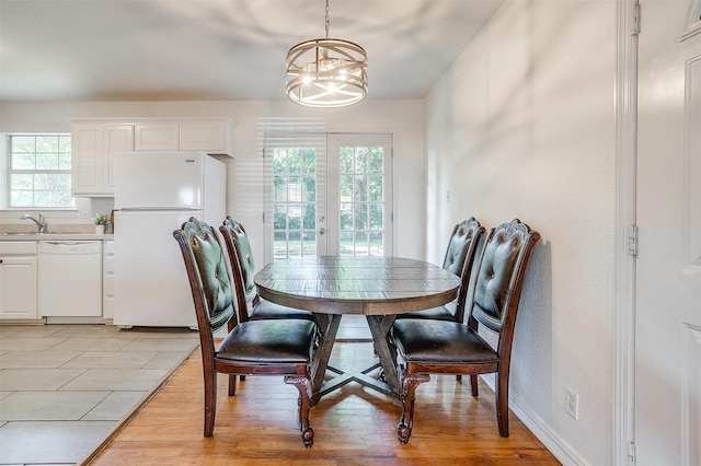 515 Euclid St, Cleburne, TX 76033 - dining space featuring plenty of natural light, a chandelier, and light wood finished floors