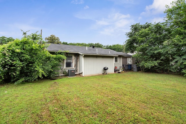 5340 Bourquin St, Dallas, TX 75210 - back of house featuring central AC and a lawn