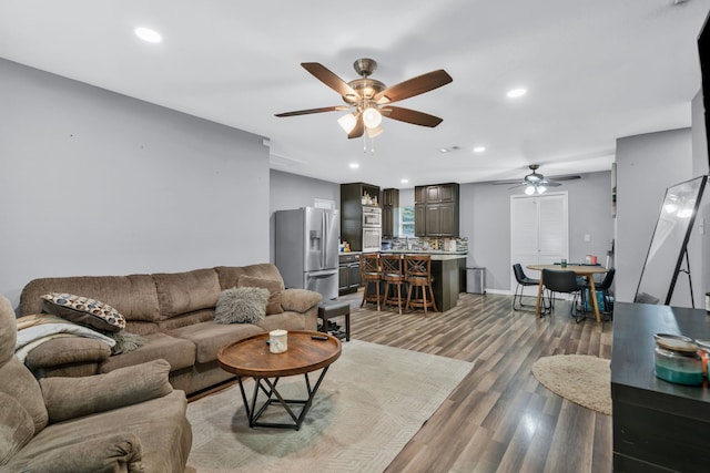5340 Bourquin St, Dallas, TX 75210 - living room featuring a ceiling fan, wood finished floors, recessed lighting, and baseboards