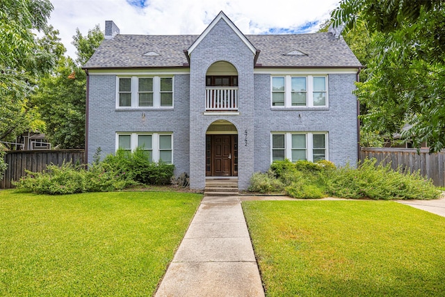 4742 Victor St, Dallas, TX 75246 - view of front of home featuring brick siding, a chimney, and roof with shingles