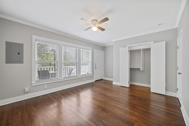 4742 Victor St, Dallas, TX 75246 - unfurnished bedroom featuring electric panel, crown molding, baseboards, wood finished floors, and a closet