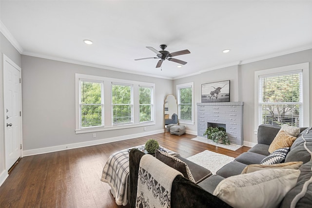 4742 Victor St, Dallas, TX 75246 - living area with ornamental molding, a ceiling fan, baseboards, wood finished floors, and a brick fireplace