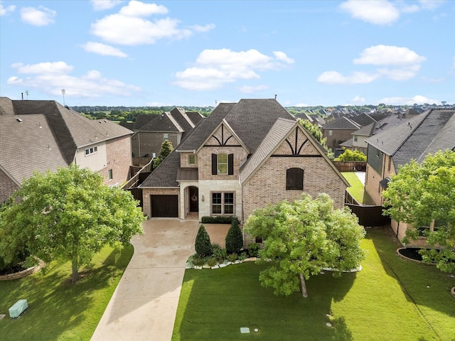 123 Deverson Dr, Rockwall, TX 75087 - view of front of property featuring concrete driveway, a residential view, stone siding, brick siding, and a shingled roof