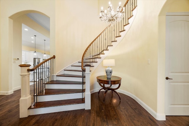 123 Deverson Dr, Rockwall, TX 75087 - stairs with wood finished floors, arched walkways, baseboards, and recessed lighting