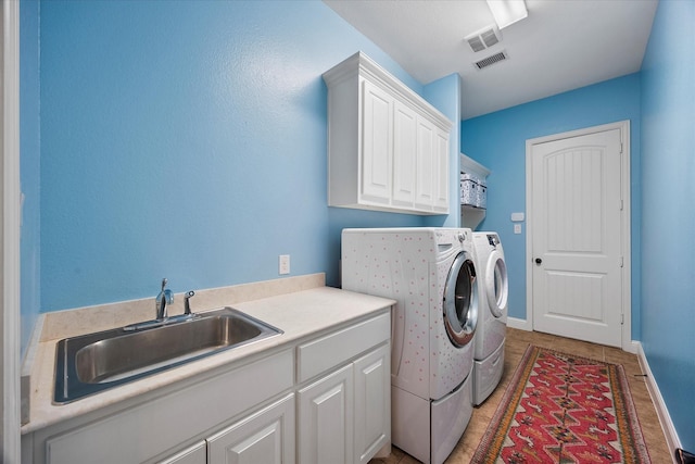 123 Deverson Dr, Rockwall, TX 75087 - laundry area featuring washing machine and dryer, cabinet space, and baseboards