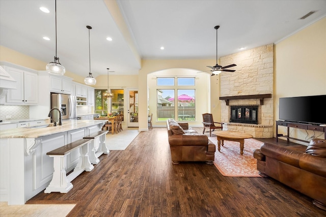 123 Deverson Dr, Rockwall, TX 75087 - living room featuring ceiling fan, dark wood-type flooring, a fireplace, and recessed lighting