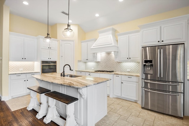 123 Deverson Dr, Rockwall, TX 75087 - kitchen with stainless steel appliances, a sink, custom exhaust hood, backsplash, and white cabinets