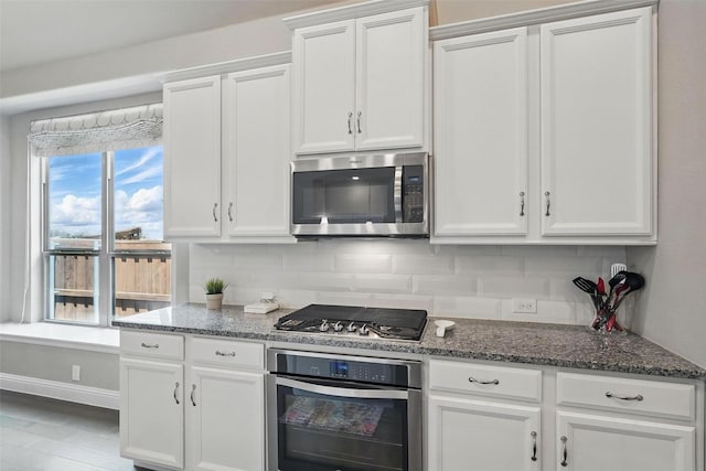 7817 Fossil Creek Trl, Mckinney, TX 75071 - kitchen featuring stainless steel appliances, white cabinetry, and decorative backsplash
