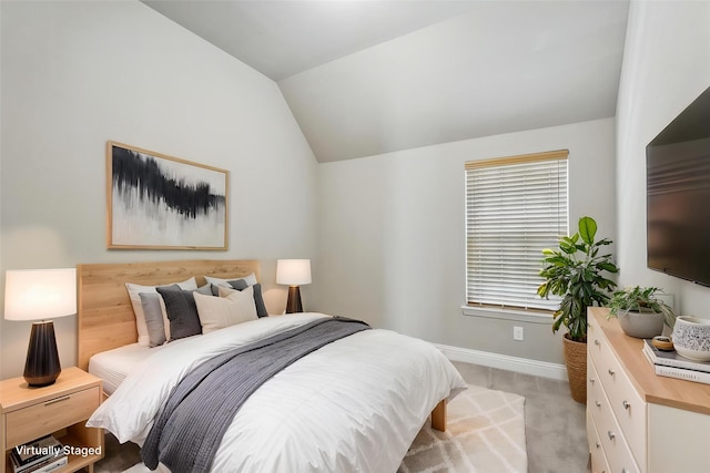 7817 Fossil Creek Trl, Mckinney, TX 75071 - bedroom featuring light carpet, baseboards, and lofted ceiling