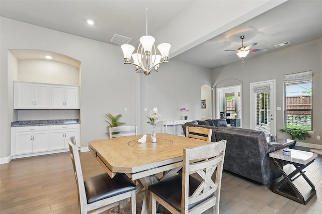 7817 Fossil Creek Trl, Mckinney, TX 75071 - dining room with light wood-style flooring, arched walkways, ceiling fan, recessed lighting, and baseboards