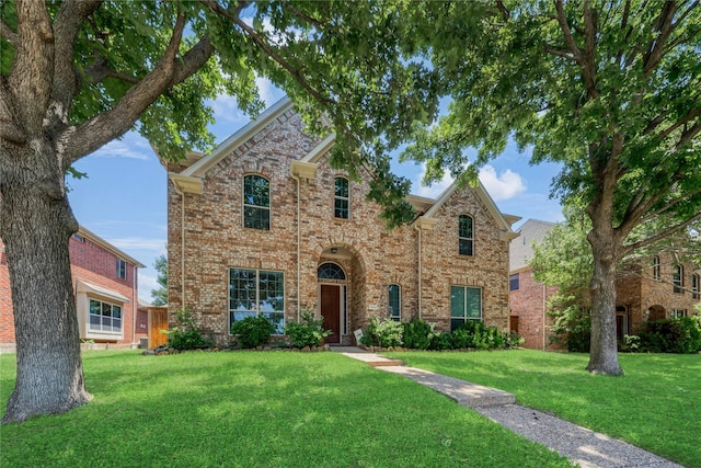 7908 Peacock Ln, Frisco, TX 75035 - traditional-style house featuring a front yard and brick siding