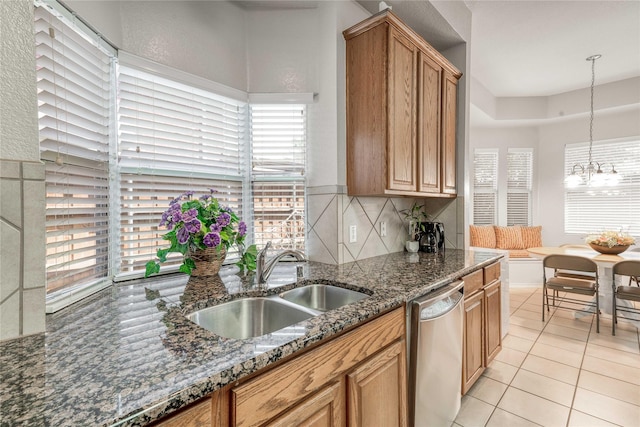 7908 Peacock Ln, Frisco, TX 75035 - kitchen with dishwasher, a sink, light tile patterned floors, a chandelier, and decorative light fixtures