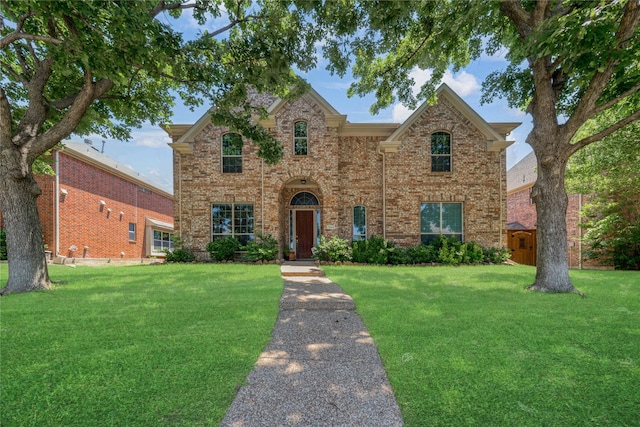 7908 Peacock Ln, Frisco, TX 75035 - traditional-style home with a front lawn and brick siding