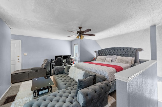9815 Walnut St Unit 204, Dallas, TX 75243 - carpeted bedroom featuring a textured ceiling and ceiling fan