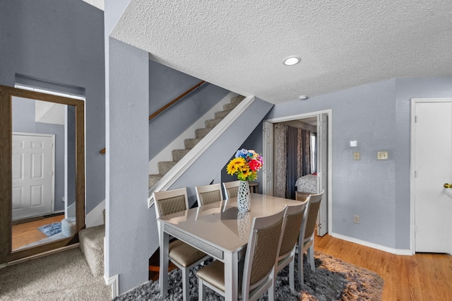 9815 Walnut St Unit 204, Dallas, TX 75243 - dining area with a textured ceiling, stairs, wood finished floors, baseboards, and recessed lighting