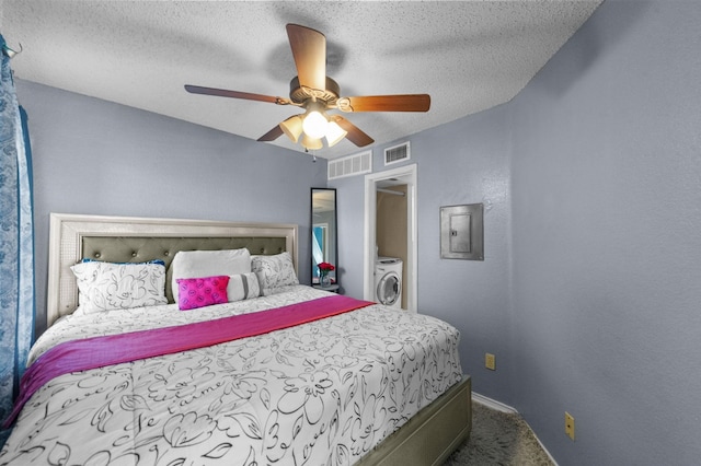 9815 Walnut St Unit 204, Dallas, TX 75243 - bedroom with carpet, electric panel, baseboards, a textured ceiling, and a ceiling fan