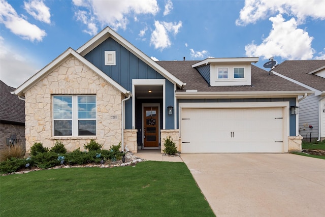 2208 Clancy Dr, Northlake, TX 76247 - view of front of property featuring board and batten siding, an attached garage, stone siding, and driveway