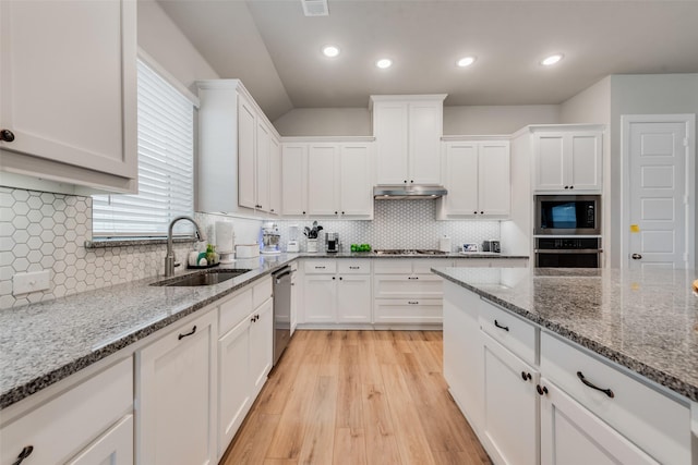2208 Clancy Dr, Northlake, TX 76247 - kitchen with a sink, stainless steel appliances, under cabinet range hood, white cabinets, and light wood-style flooring