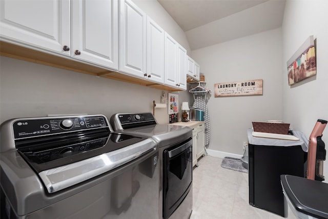 2208 Clancy Dr, Northlake, TX 76247 - laundry room with washing machine and dryer, cabinet space, light tile patterned floors, and baseboards
