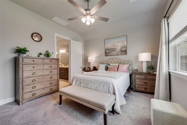 2208 Clancy Dr, Northlake, TX 76247 - bedroom featuring light carpet, ensuite bath, vaulted ceiling, a ceiling fan, and baseboards