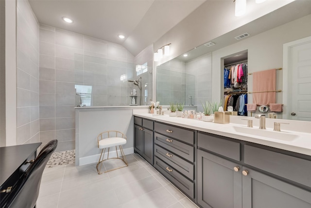 2208 Clancy Dr, Northlake, TX 76247 - bathroom with double vanity, walk in shower, tile patterned floors, lofted ceiling, and recessed lighting