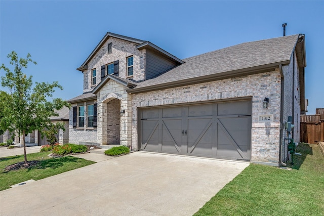 1312 Hutchings Ct, Celina, TX 75009 - view of front facade with stone siding, concrete driveway, a garage, a shingled roof, and brick siding