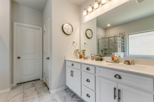 1312 Hutchings Ct, Celina, TX 75009 - full bathroom featuring double vanity, a shower stall, marble finish floors, and baseboards