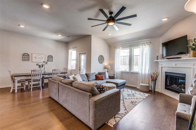 1312 Hutchings Ct, Celina, TX 75009 - living room featuring ceiling fan, a brick fireplace, dark wood finished floors, baseboards, and recessed lighting