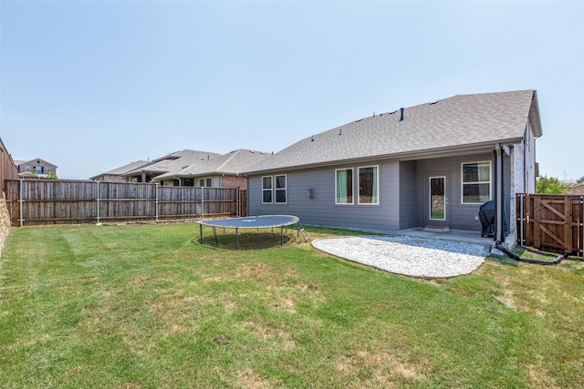 1312 Hutchings Ct, Celina, TX 75009 - back of house featuring a patio area and a trampoline