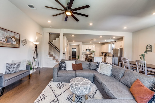 1312 Hutchings Ct, Celina, TX 75009 - living area featuring dark wood-style flooring, a ceiling fan, recessed lighting, stairway, and baseboards