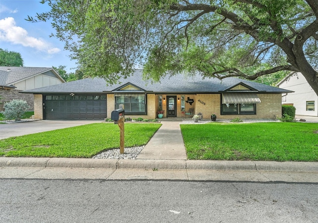 4109 Three Oaks Dr, Arlington, TX 76016 - view of front of home featuring a garage, a front yard, concrete driveway, and a shingled roof